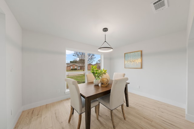 dining area with light wood-type flooring