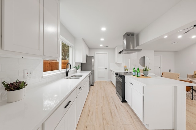 kitchen featuring sink, white cabinetry, black electric range oven, decorative backsplash, and ventilation hood