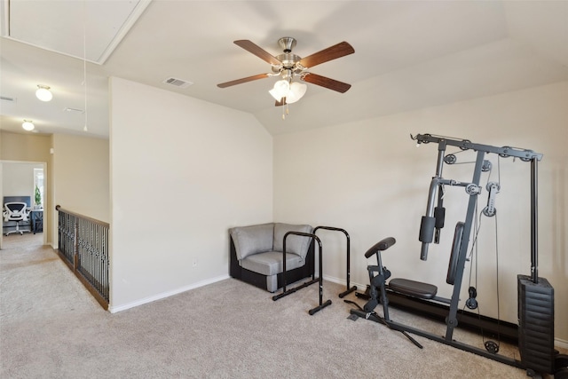 exercise area with ceiling fan, light carpet, and lofted ceiling