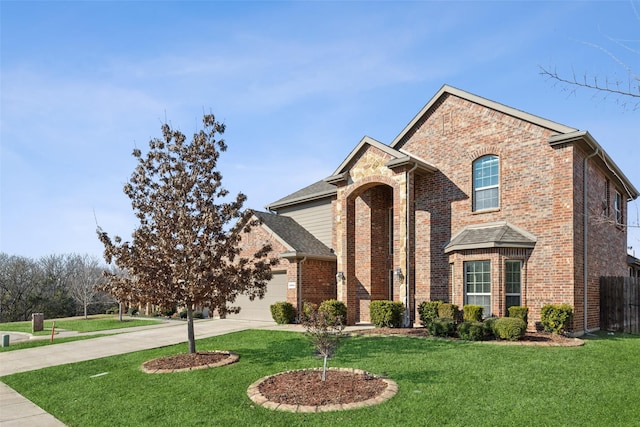 front of property featuring a front lawn and a garage