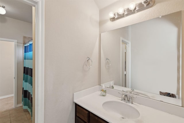 bathroom with vanity, tile patterned floors, and a shower with curtain