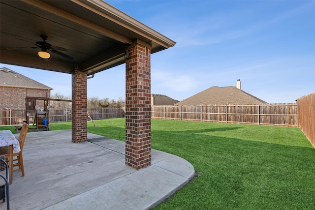 exterior space with a patio area, a playground, and ceiling fan