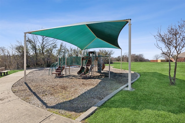 view of jungle gym featuring a lawn