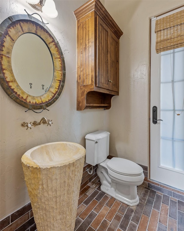 bathroom with sink and toilet