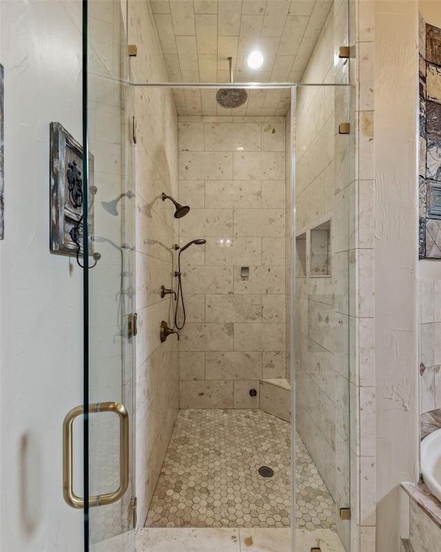 bathroom featuring independent shower and bath