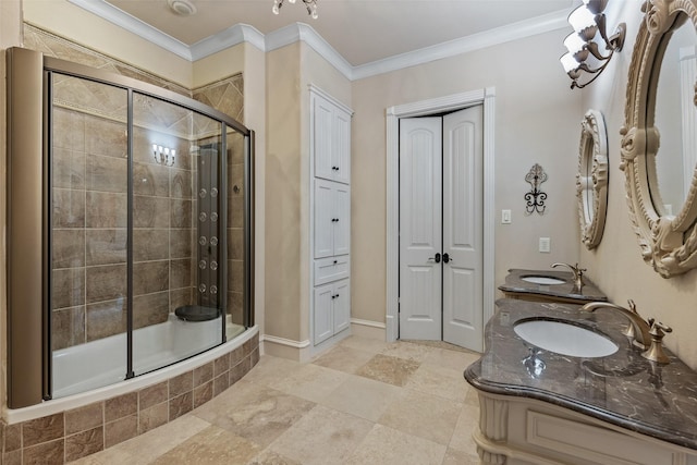 bathroom with enclosed tub / shower combo, ornamental molding, and vanity