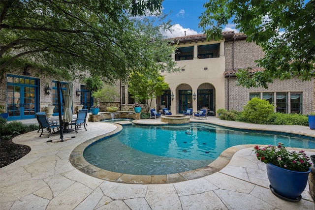 view of pool featuring a patio