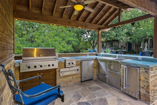 view of patio / terrace featuring a gazebo, area for grilling, ceiling fan, and a grill