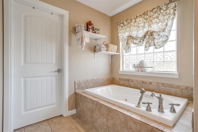 bathroom with tile patterned floors and tiled tub