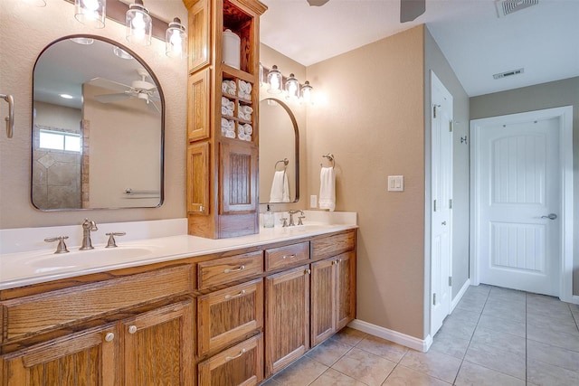 bathroom with ceiling fan, vanity, and tile patterned floors