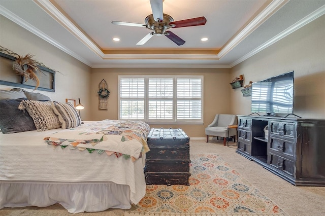 carpeted bedroom featuring ornamental molding, a raised ceiling, and ceiling fan