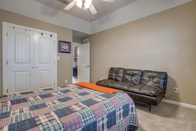 carpeted bedroom featuring a closet and ceiling fan