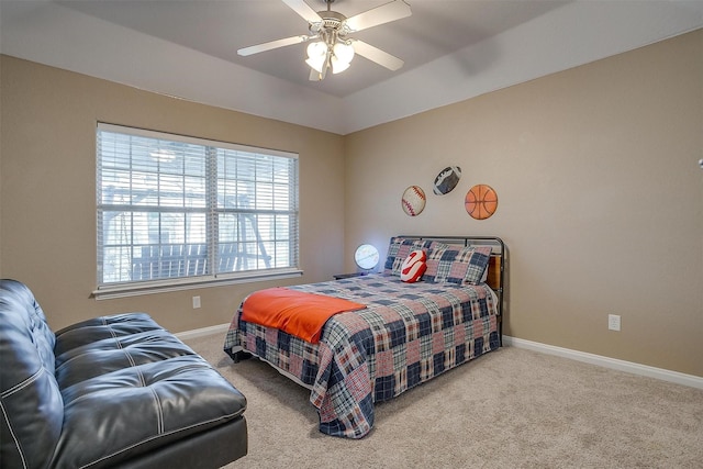 carpeted bedroom featuring vaulted ceiling and ceiling fan