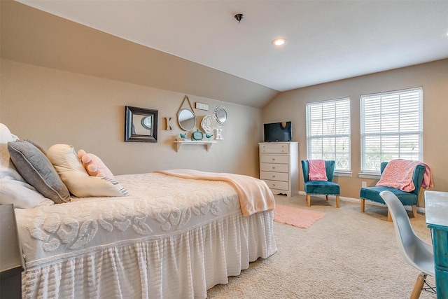 bedroom with carpet and vaulted ceiling