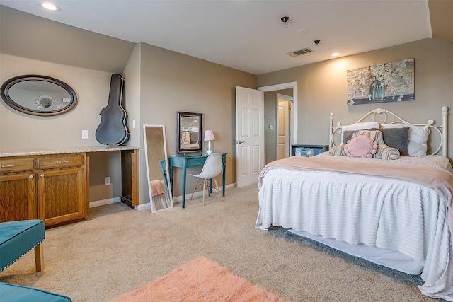 bedroom featuring light carpet