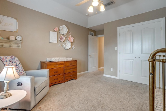 sitting room with ceiling fan and light carpet