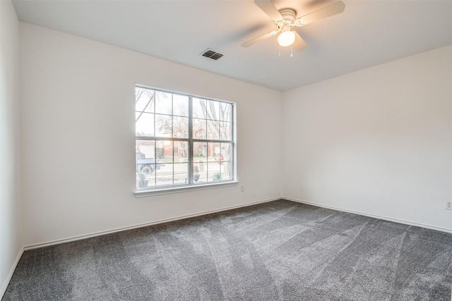 unfurnished room with ceiling fan and carpet floors