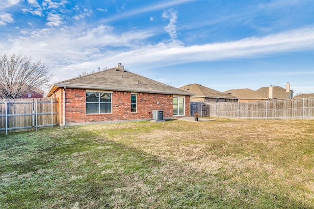 back of property featuring a patio area, a lawn, and central air condition unit