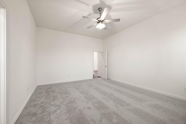 spare room featuring carpet floors and ceiling fan