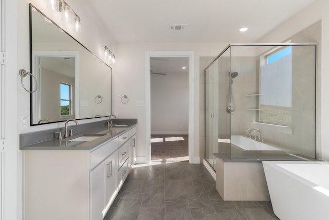 bathroom featuring vanity and plus walk in shower