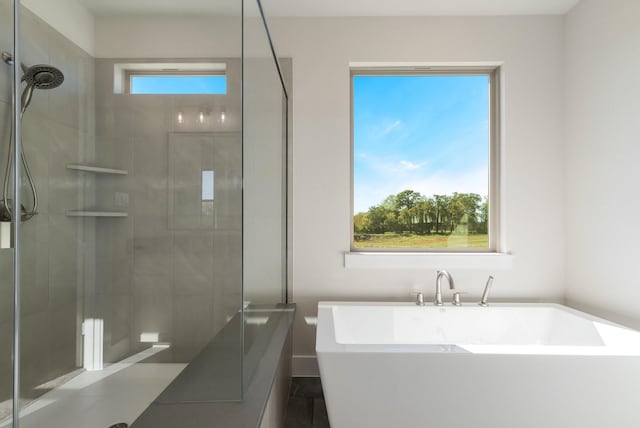 bathroom featuring shower with separate bathtub and tile patterned floors