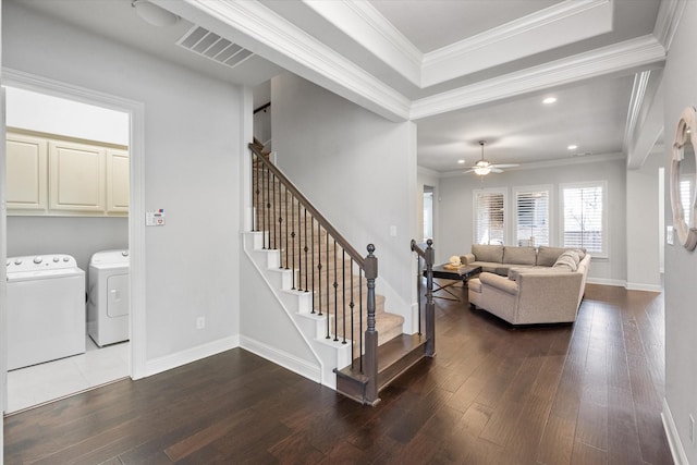 living room featuring separate washer and dryer, crown molding, wood-type flooring, and ceiling fan