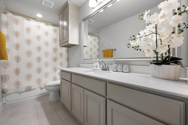 full bathroom featuring shower / bath combination with curtain, toilet, vanity, and tile patterned flooring