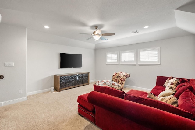 carpeted living room featuring ceiling fan