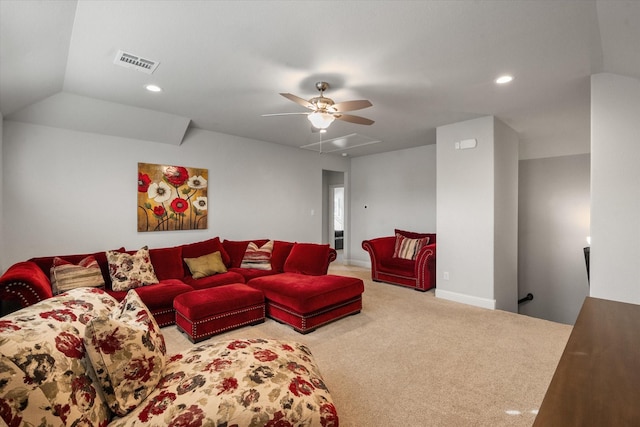 living room featuring ceiling fan, carpet, and lofted ceiling