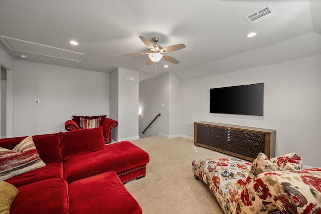 carpeted living room featuring ceiling fan