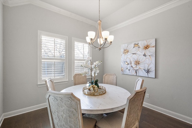 dining area featuring dark hardwood / wood-style floors, ornamental molding, and a notable chandelier