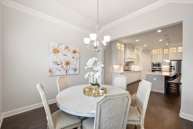 dining room featuring a chandelier, crown molding, and dark hardwood / wood-style floors