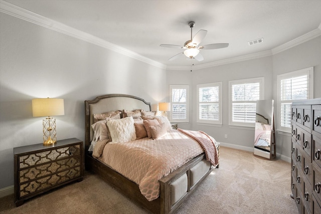 carpeted bedroom featuring ceiling fan and ornamental molding