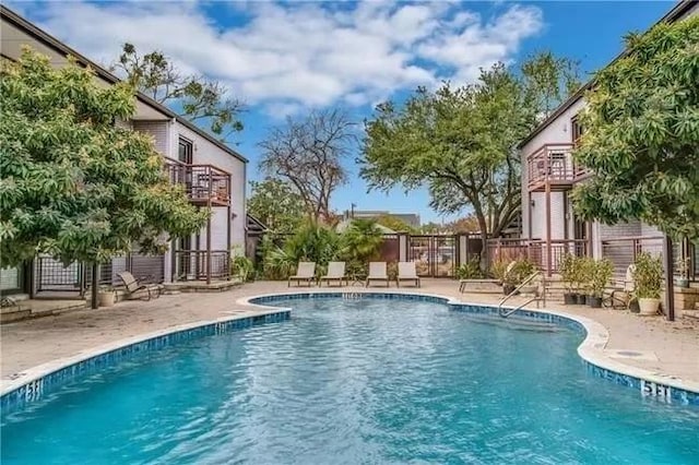 view of pool featuring a patio