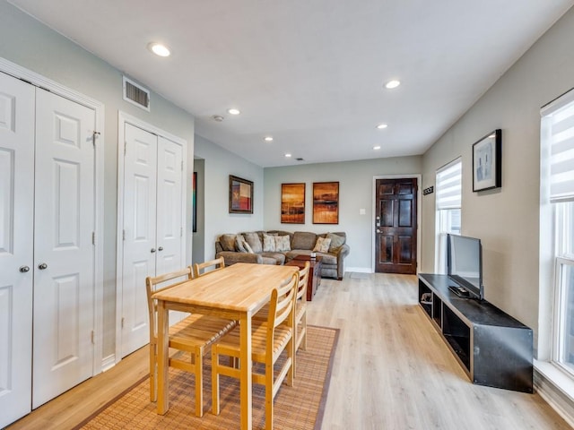 dining space with light hardwood / wood-style flooring