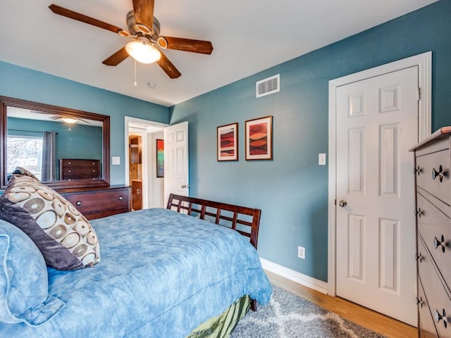 bedroom with ceiling fan and light hardwood / wood-style flooring