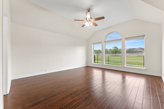 unfurnished room with lofted ceiling, ceiling fan, and dark wood-type flooring