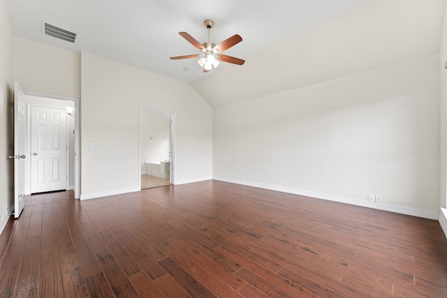 unfurnished room with ceiling fan, vaulted ceiling, and dark wood-type flooring