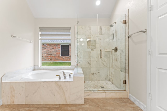 bathroom with shower with separate bathtub