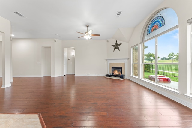 unfurnished living room with vaulted ceiling, ceiling fan, and hardwood / wood-style floors