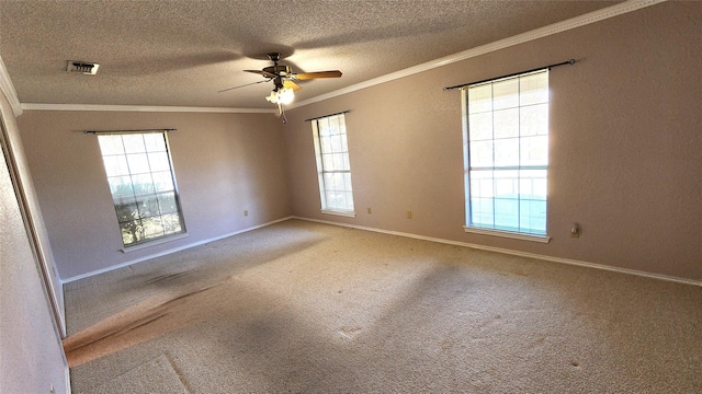 spare room featuring ornamental molding, a textured ceiling, carpet floors, and ceiling fan