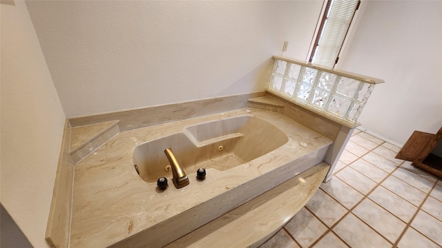 bathroom featuring a bath and tile patterned floors