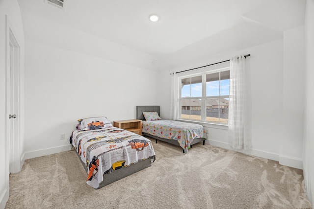 bedroom featuring light colored carpet