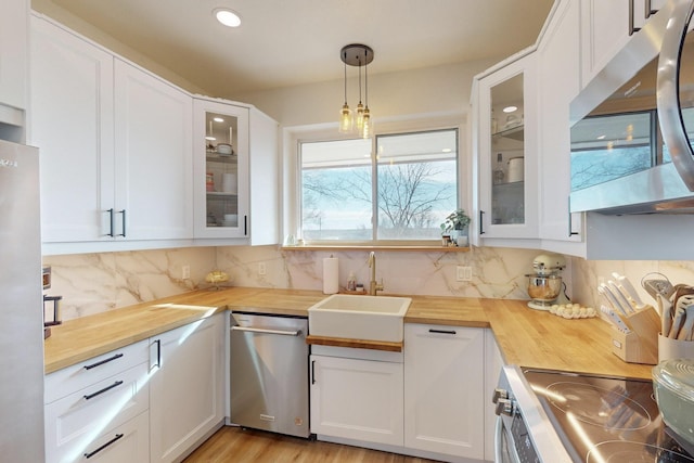 kitchen featuring appliances with stainless steel finishes and white cabinetry