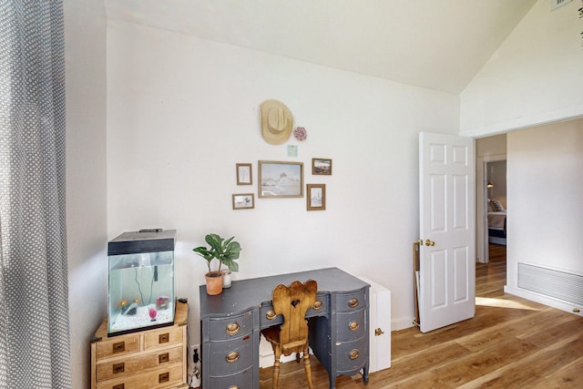 office area with lofted ceiling and hardwood / wood-style flooring