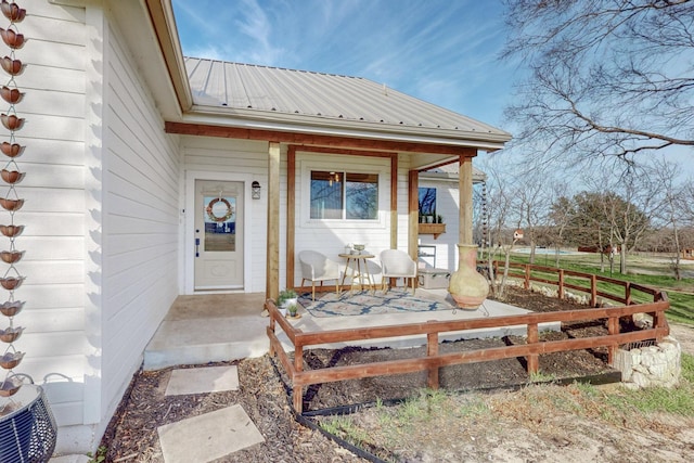 view of exterior entry featuring a porch