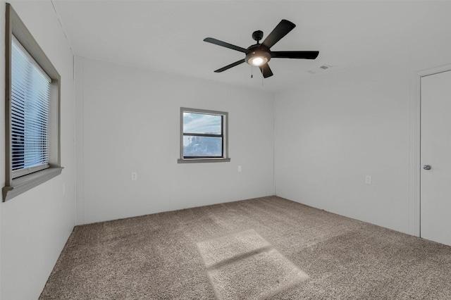 unfurnished room featuring carpet floors and ceiling fan