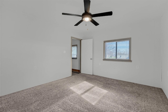 empty room featuring carpet flooring and ceiling fan