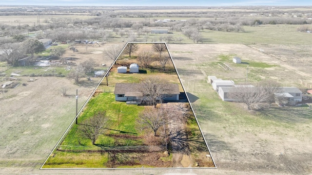 birds eye view of property featuring a rural view