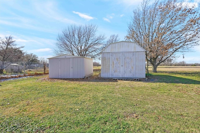 view of outbuilding with a yard